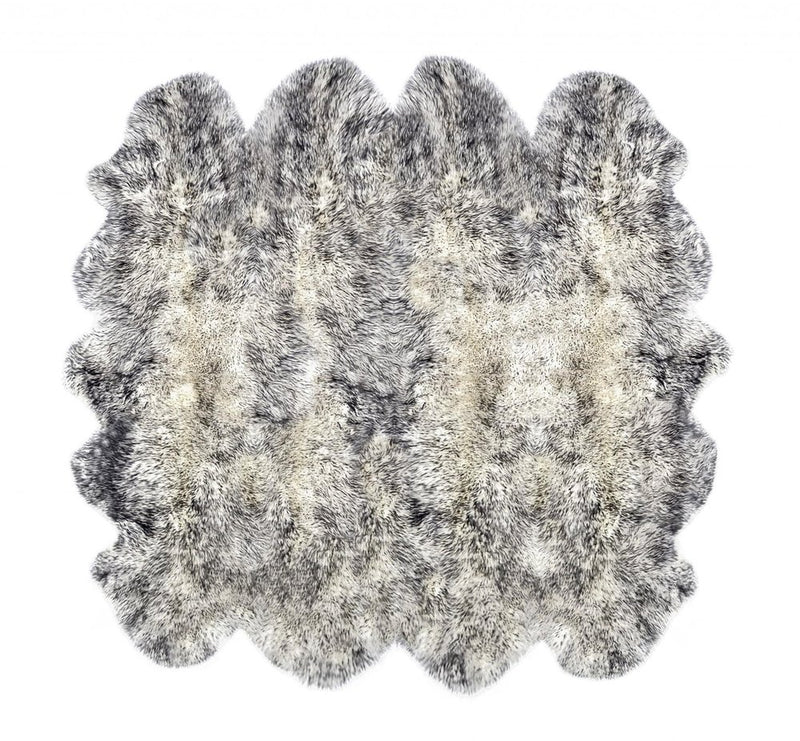 Gradient Gray Animal Print Area Rug with a soft, textured surface in shades of gray and cream, featuring a unique wavy shape.