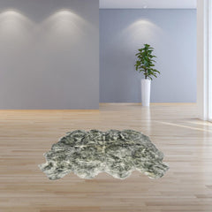 Gradient Gray Animal Print Area Rug featuring a soft, textured design, placed on a light wooden floor in a modern room.