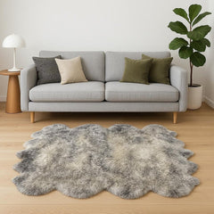 Gradient Gray Animal Print Area Rug featuring a soft, textured design, placed in a cozy living room with a gray sofa and deco