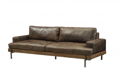 95" Chocolate Top Grain Leather Sofa with black legs, featuring a modern design and plush cushions for comfort.