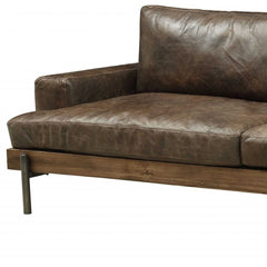 95" Chocolate Top Grain Leather Sofa with black legs, featuring a sleek design and plush cushions for comfort.