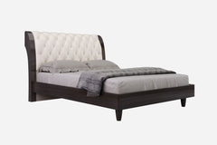 Solid wood king bed with tufted beige faux leather upholstery and nailhead trim, featuring a sleek design and dark wood finis