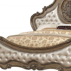 Queen Tufted Bronze Upholstered Faux Leather Bed features elegant nailhead trim and intricate detailing on the headboard.