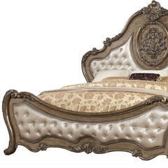 Queen Tufted Bronze Upholstered Faux Leather Bed with Nailhead Trim featuring ornate detailing and a luxurious design.