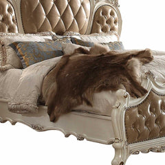 Pearl King Tufted Upholstered Faux Leather Bed Frame with Nailhead Trim, featuring a luxurious design and plush bedding.