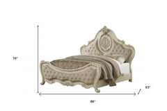 Antiqued white solid wood tufted upholstered linen bed frame with ornate design, featuring a high headboard and elegant curve
