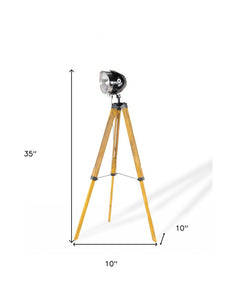 35" brown tripod floor lamp with a cone-shaped shade, featuring wooden legs and a sleek design. Ideal for modern decor.