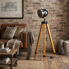 35" Brown Tripod Floor Lamp with Cone features a stylish design, wooden tripod legs, and a vintage-inspired cone shade.