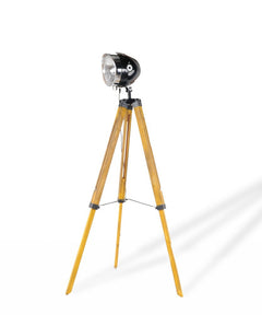 35" Brown Tripod Floor Lamp with Cone features a sleek black lamp head and natural wood tripod legs, creating a modern look.
