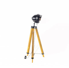 35" Brown Tripod Floor Lamp with Cone features a sleek black cone shade and sturdy wooden tripod legs.