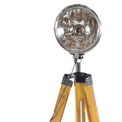 35" brown tripod floor lamp with a cone-shaped shade and wooden legs, featuring a metallic light fixture.