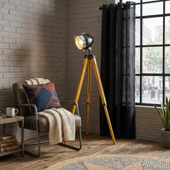 35" Brown Tripod Floor Lamp with Cone featuring a stylish design, set in a cozy room with a chair and decorative elements.