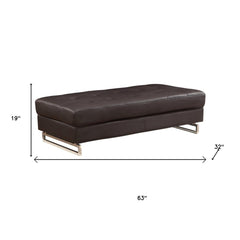 63" Brown and Silver Faux Leather Tufted Ottoman with a sleek design, featuring a tufted top and modern metal legs.