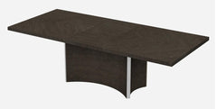 Gray solid wood dining table with a unique base design, featuring a rectangular top and two extension leaves.