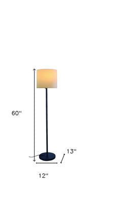 60" black and white floor lamp with a white fabric drum shade, featuring a sleek design and a sturdy base.