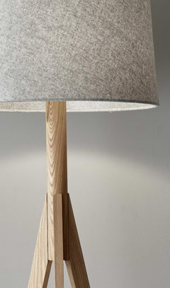 59" Natural Solid Wood Tripod Floor Lamp featuring a gray fabric empire shade, showcasing a minimalist design with a wooden b