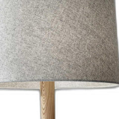 Natural solid wood tripod floor lamp with a gray fabric empire shade, showcasing a textured shade and wooden base.