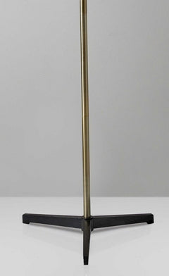 Brass metal floor lamp base with a black iron tripod stand, designed for stability and style. Ideal for modern decor.