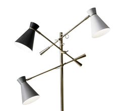 71" Brass Metal Novelty Floor Lamp featuring three adjustable cone shades in black and white, mounted on a sleek brass frame.