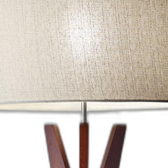 60" brown and white solid wood tripod floor lamp with a white fabric drum shade, showcasing a textured shade and stylish base
