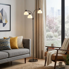69" Silver Three Light Tree Floor Lamp with White Plastic Bowl Shade, featuring a modern design in a cozy living room setting