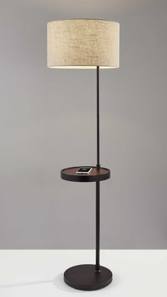 64" beige and black tray table floor lamp with a beige fabric drum shade and a circular tray for holding items.