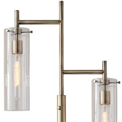 Brass Metal Two Light Novelty Floor Lamp featuring clear glass drum shades and a modern design. Ideal for stylish lighting.