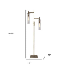 Brass metal two-light floor lamp with clear glass drum shades, standing 64.25 inches tall and 19 inches wide.