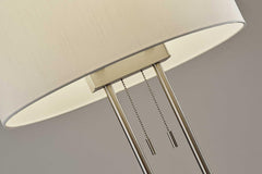 62" Silver Metal Task Floor Lamp featuring a white fabric drum shade and pull chain switches for easy operation.