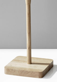 Natural solid wood floor lamp base with a square wooden base and a smooth pole, designed for a white linen drum shade.