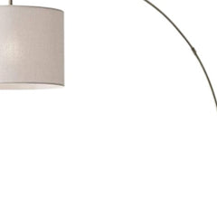 74" Brass Metal Arc Floor Lamp with off-white linen drum shade, featuring a sleek curved design and elegant finish.