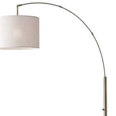 74" Brass Metal Arc Floor Lamp with Off White Linen Drum Shade featuring a sleek, curved design and elegant shade.
