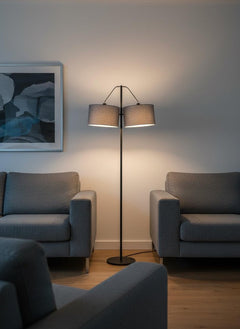 91" Silver Three Light Tree Floor Lamp with Gray Linen Drum Shade, featuring a sleek design and soft lighting in a cozy setti