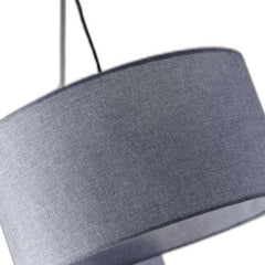 Silver three light tree floor lamp with gray linen drum shade, featuring a modern design and textured fabric.
