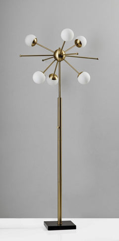 64" Brass Six Light LED Novelty Floor Lamp featuring white glass globe shades and a sleek design on a black base.