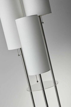 68" Silver Three Light Novelty Floor Lamp featuring white linen cylinder shades and a sleek glass base.