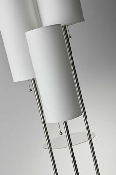 68" Silver Three Light Novelty Floor Lamp featuring white linen cylinder shades and a glass accent table.