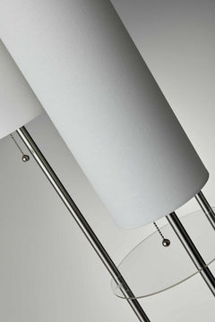 68" silver three-light floor lamp featuring white linen cylinder shades and a sleek metallic design. Ideal for modern decor.