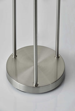 Silver base of a 68" floor lamp with three light fixtures and a white linen cylinder shade. Sleek and modern design.