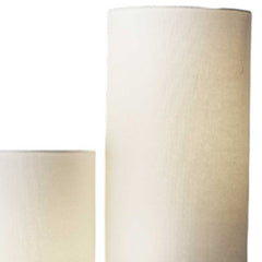 Silver three-light floor lamp with white linen cylinder shades, standing 68 inches tall, showcasing a modern design.