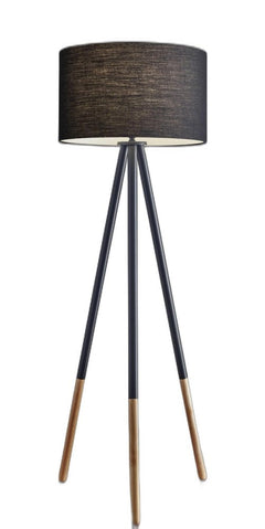 Black Metal Tripod Floor Lamp with a black fabric drum shade and wooden accents on the legs, offering a modern design.