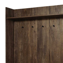 Brown wood hall tree featuring a cream fabric wrapped seat and multiple hooks for storage. Ideal for entryway organization.