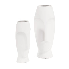 Set of two ceramic white cylinder table vases with abstract face designs, featuring smooth finishes and modern shapes.