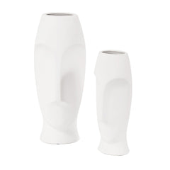Set of two ceramic white cylinder table vases with abstract face designs, one tall and one short. Ideal for home decor.