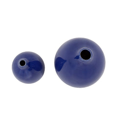 Set of two cobalt ceramic round table vases in varying sizes, featuring a smooth, glossy finish and narrow openings.