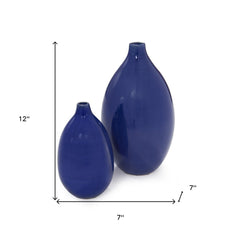 Set of two cobalt ceramic round table vases, one 12 inches and the other 7 inches tall, with a glossy finish.