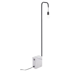 59" Black and White Steel LED Floor Lamp featuring a sleek black metal arm and a marble base with a minimalist design.