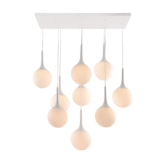 Dimmable ceiling light with nine white shaded pendant bulbs hanging from a white ceiling plate. Modern and stylish design.