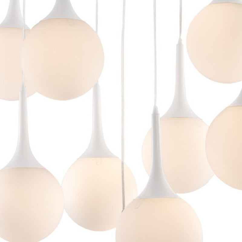 White Shaded Nine Light Metal Dimmable Ceiling Light featuring round glass shades and sleek white fixtures, ideal for modern 