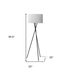 66" black tripod floor lamp with a white fabric drum shade, featuring a modern design and sleek lines.
